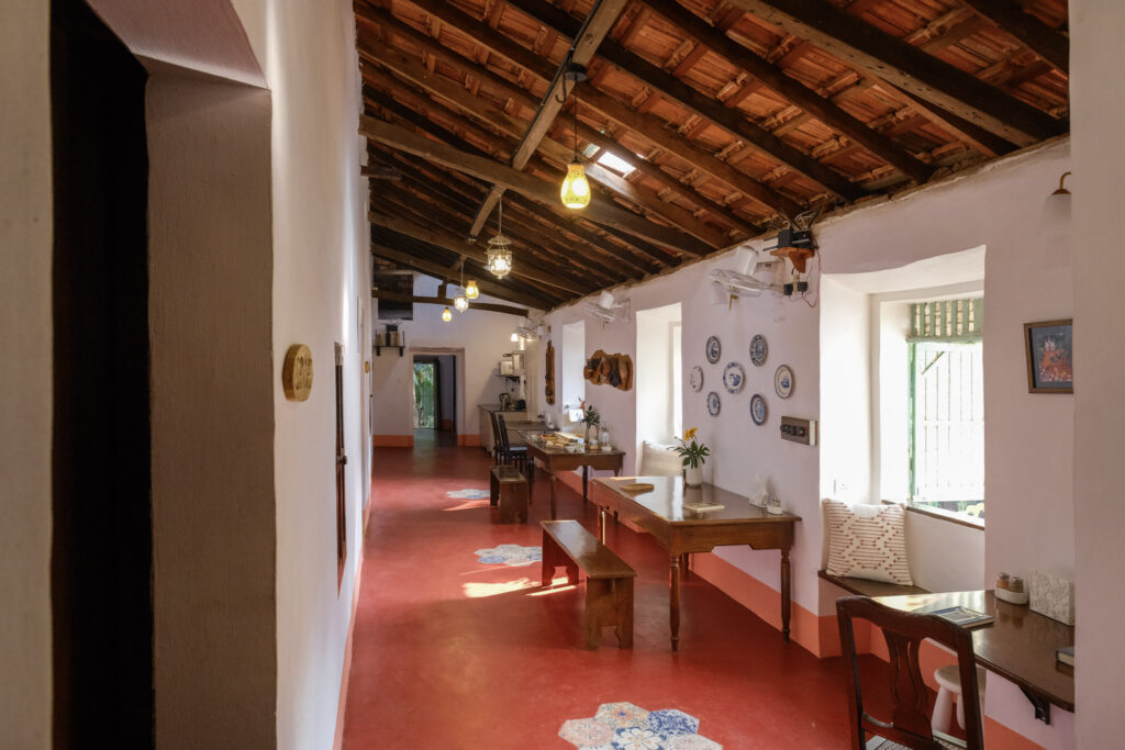 Restored heritage corridor at Quinta Verde with original wood-beamed ceiling